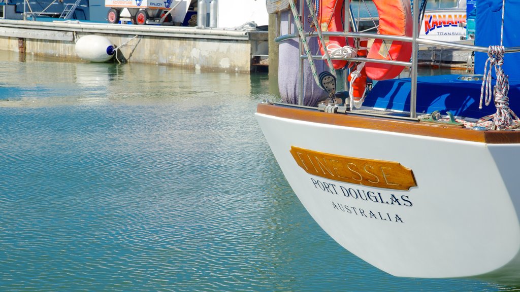 Marina Mirage showing boating, a marina and signage