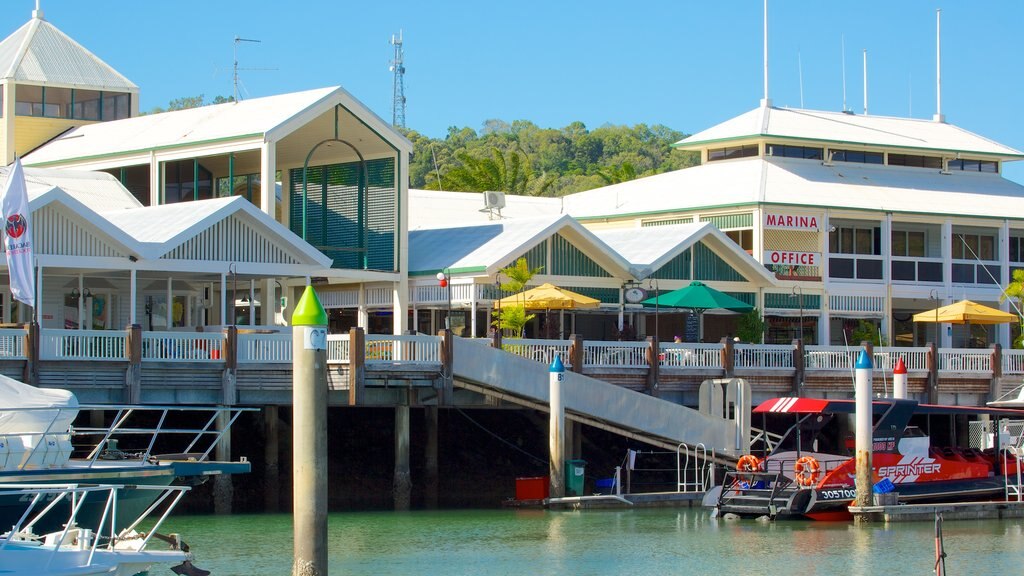 Marina Mirage showing a coastal town, a sunset and boating