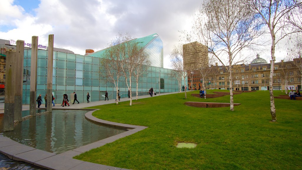 National Football Museum showing modern architecture, a garden and a pond