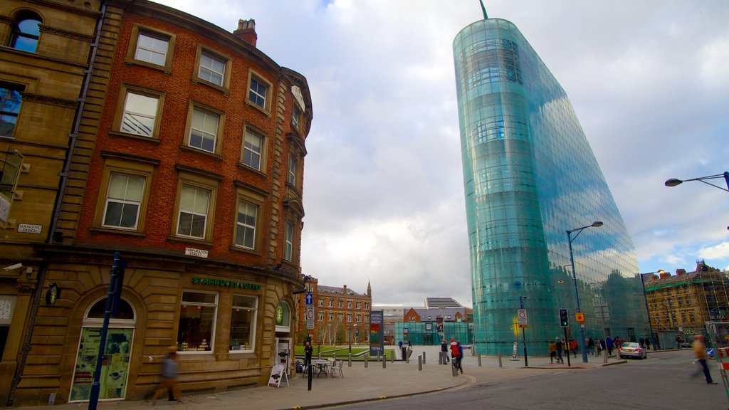 National Football Museum showing a city, modern architecture and street scenes