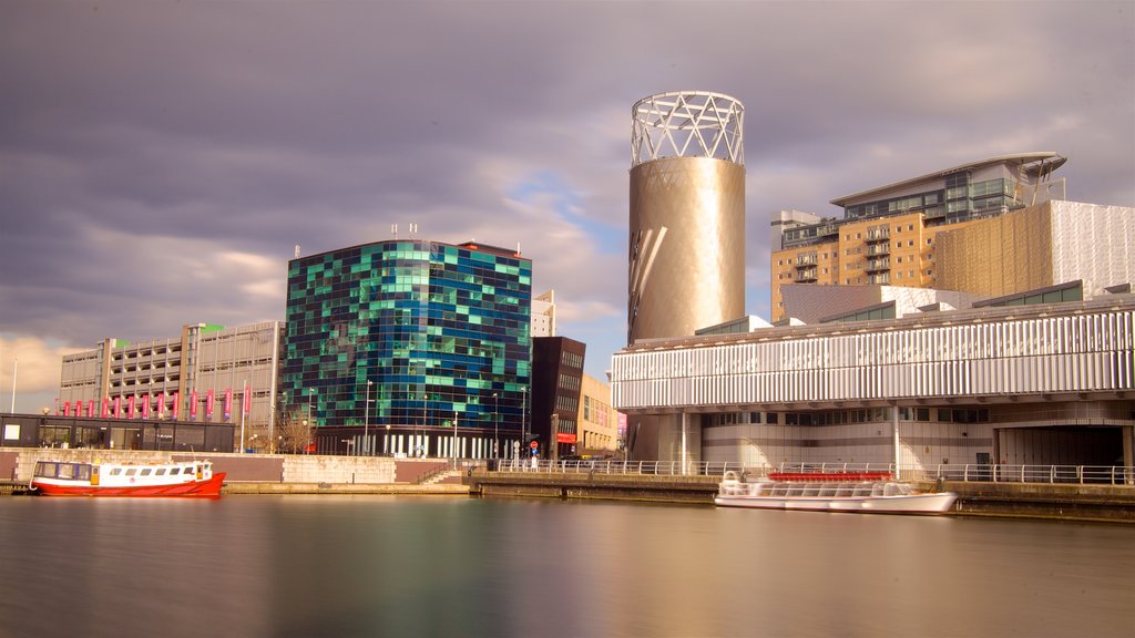 Salford Quays which includes a city, modern architecture and a bay or harbour