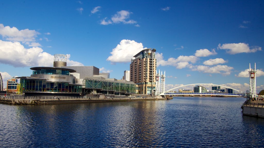 Imperial War Museum North showing a city, a bridge and a river or creek