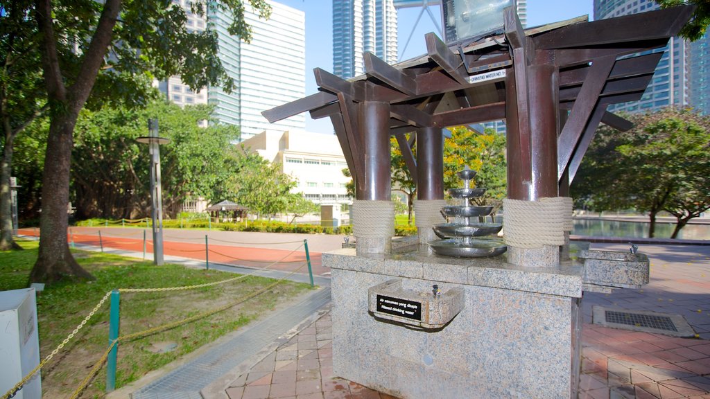 KLCC Park which includes a garden and a fountain