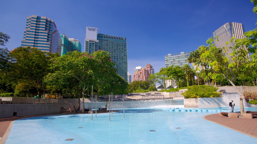 KLCC Park showing a city, a pool and a garden