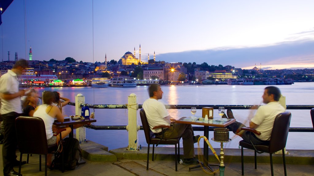 Galata Bridge showing a sunset, a bar and a coastal town