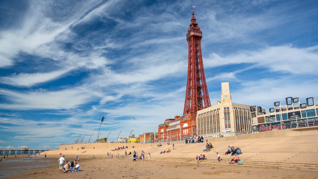 Blackpool Tower which includes a sandy beach, a coastal town and modern architecture