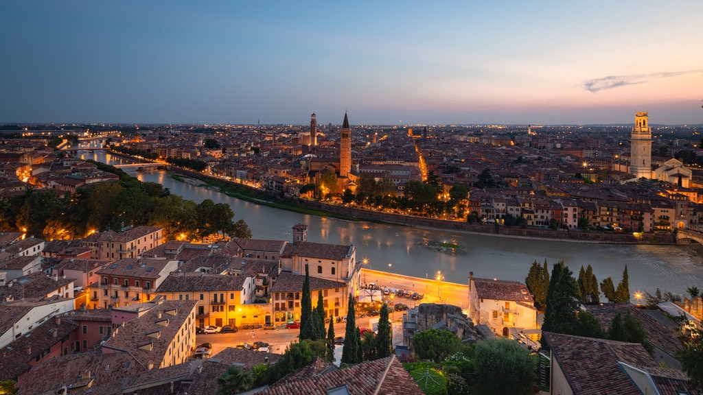 St. Peter\'s Castle showing a city, a river or creek and a sunset