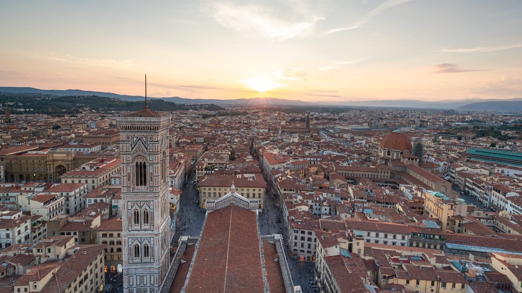 Giotto\'s Campanile featuring a city, landscape views and a sunset