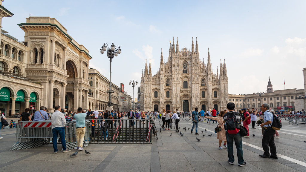 Piazza del Duomo featuring a church or cathedral, heritage architecture and street scenes