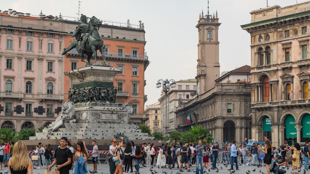 Piazza del Duomo which includes a statue or sculpture, street scenes and a square or plaza