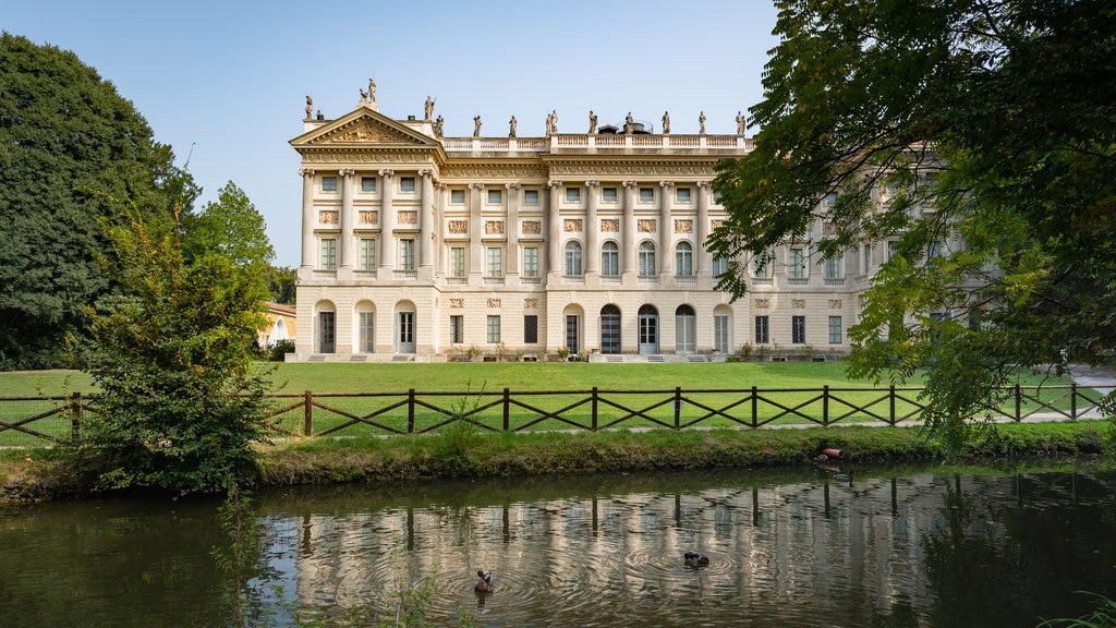 Villa Reale featuring a pond and heritage architecture