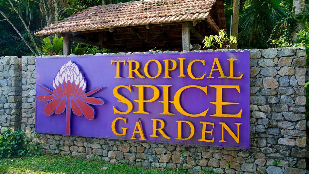 Tropical Spice Garden which includes a garden and signage