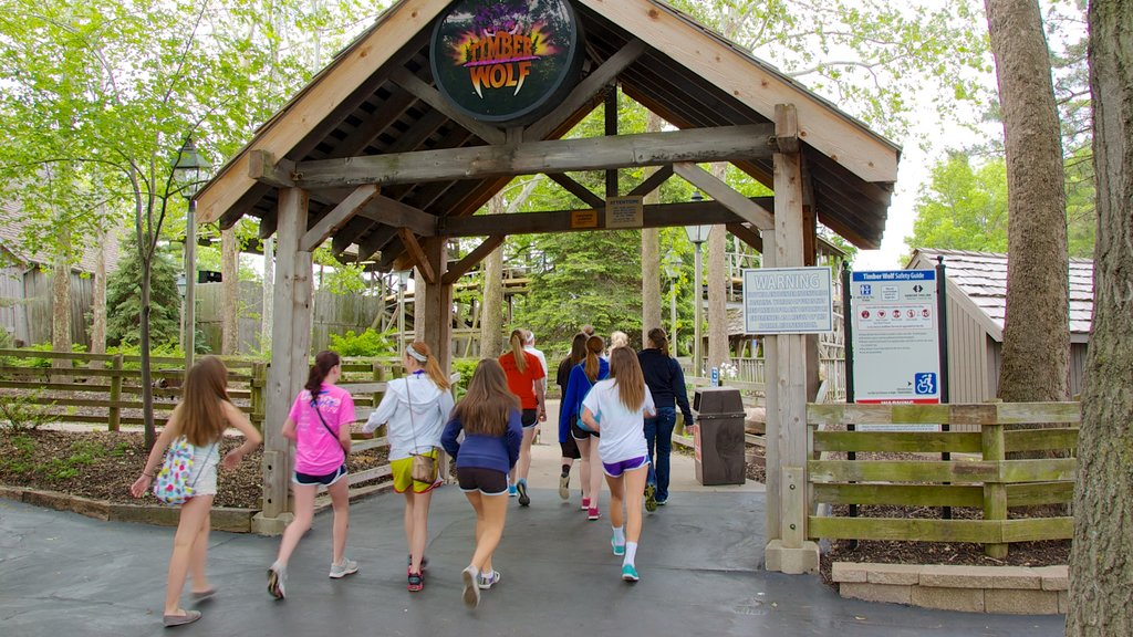 Worlds of Fun showing rides and signage as well as a small group of people