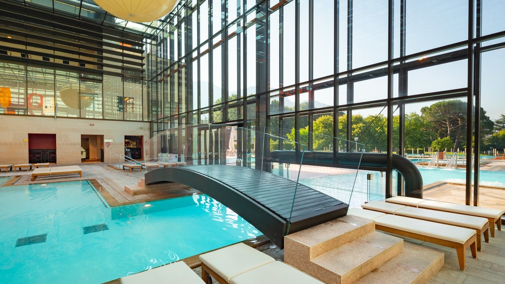 Merano Thermal Baths showing a pool, a bridge and interior views