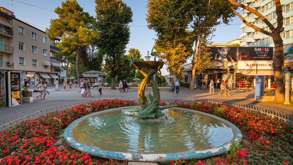 Palais du Tourisme de Riccione montrant fontaine et fleurs