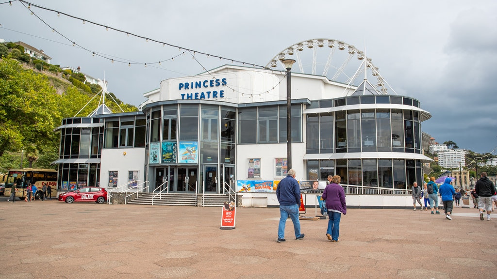 Princess Theatre showing street scenes and signage as well as a couple