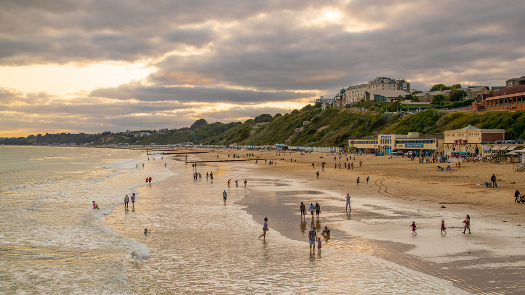 Bournemouth Pier featuring a beach, landscape views and a sunset