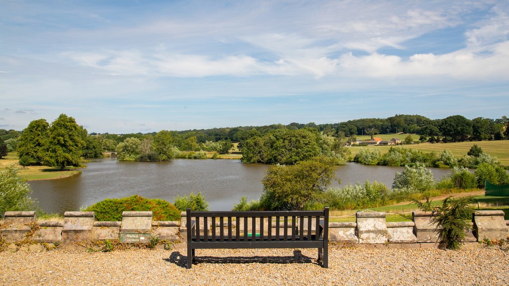 Ripley Castle and Gardens showing a lake or waterhole and a park