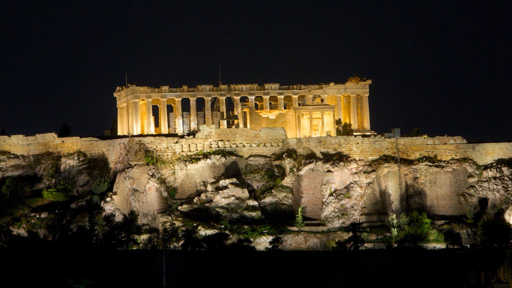 Acropolis which includes night scenes, building ruins and heritage elements