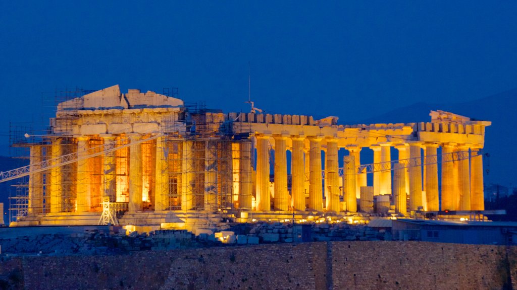 Acropolis featuring heritage elements, night scenes and a ruin