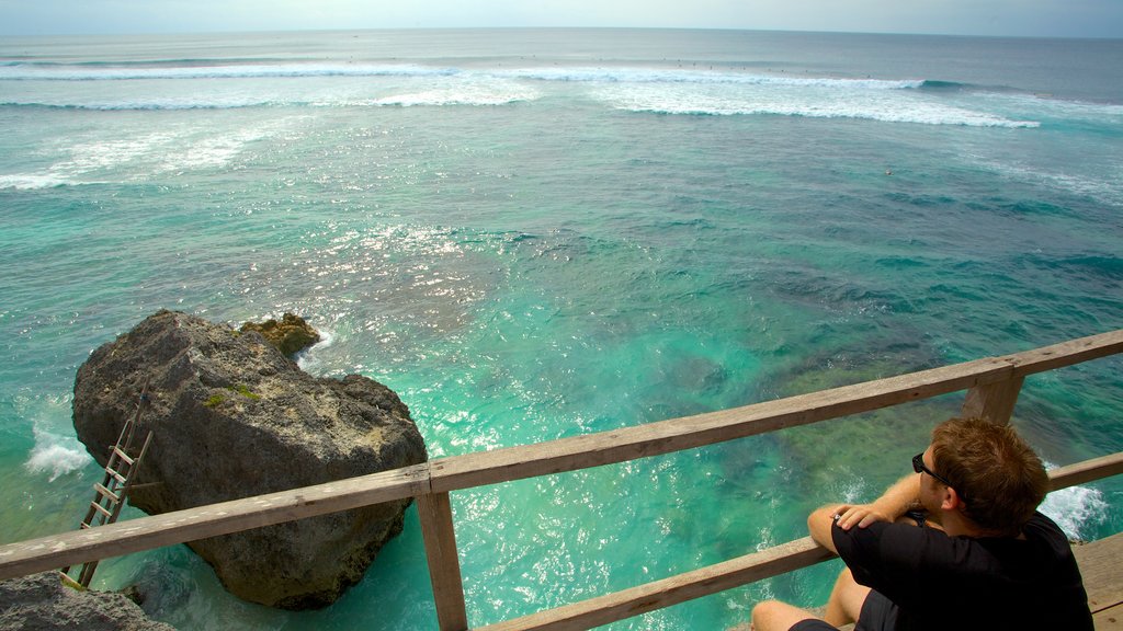 Uluwatu Beach which includes general coastal views, views and rugged coastline