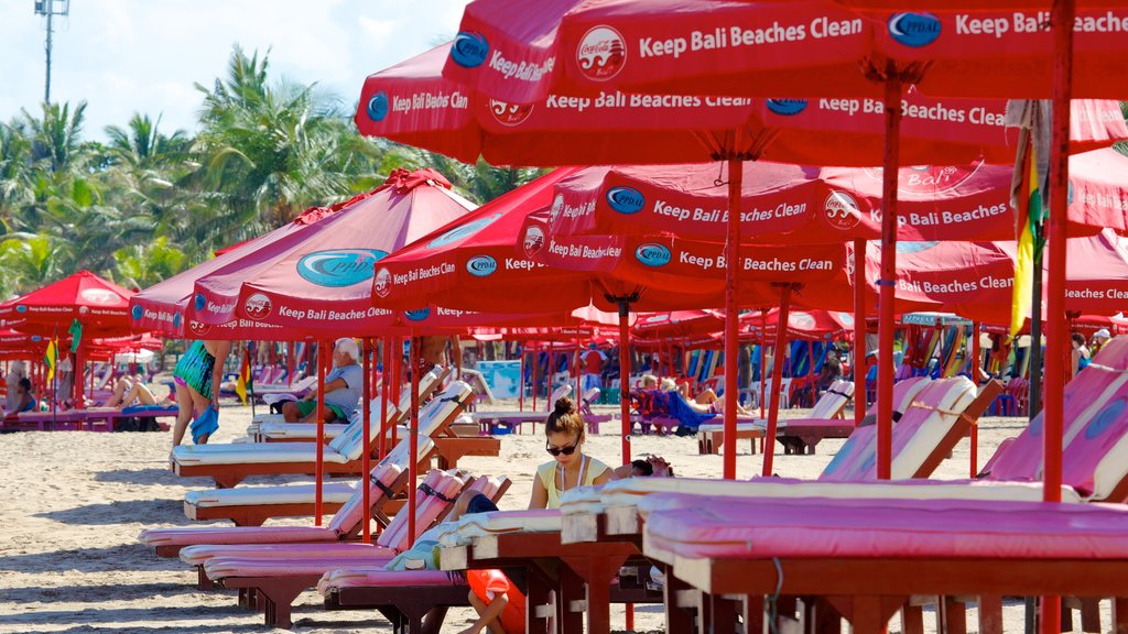 Kuta Beach showing a sandy beach and a luxury hotel or resort