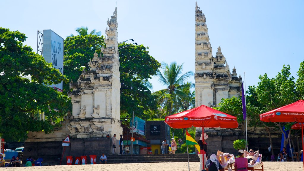 Kuta Beach showing a temple or place of worship, tropical scenes and street scenes