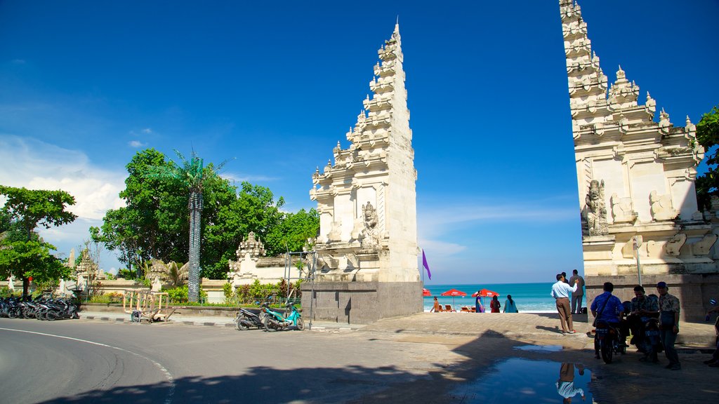 Kuta Beach which includes general coastal views and street scenes