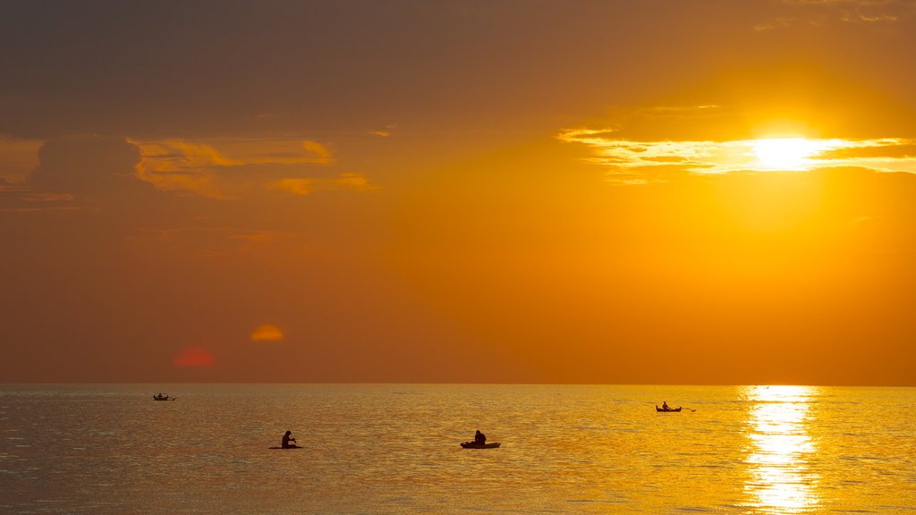 Jimbaran Beach which includes landscape views and a sunset