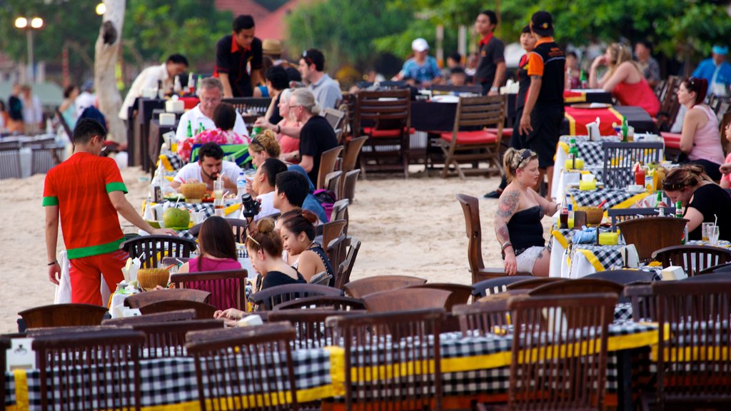 Jimbaran Beach showing a beach, dining out and outdoor eating