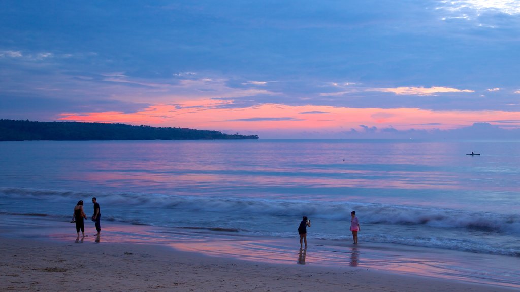 Jimbaran Beach showing a sunset and a sandy beach