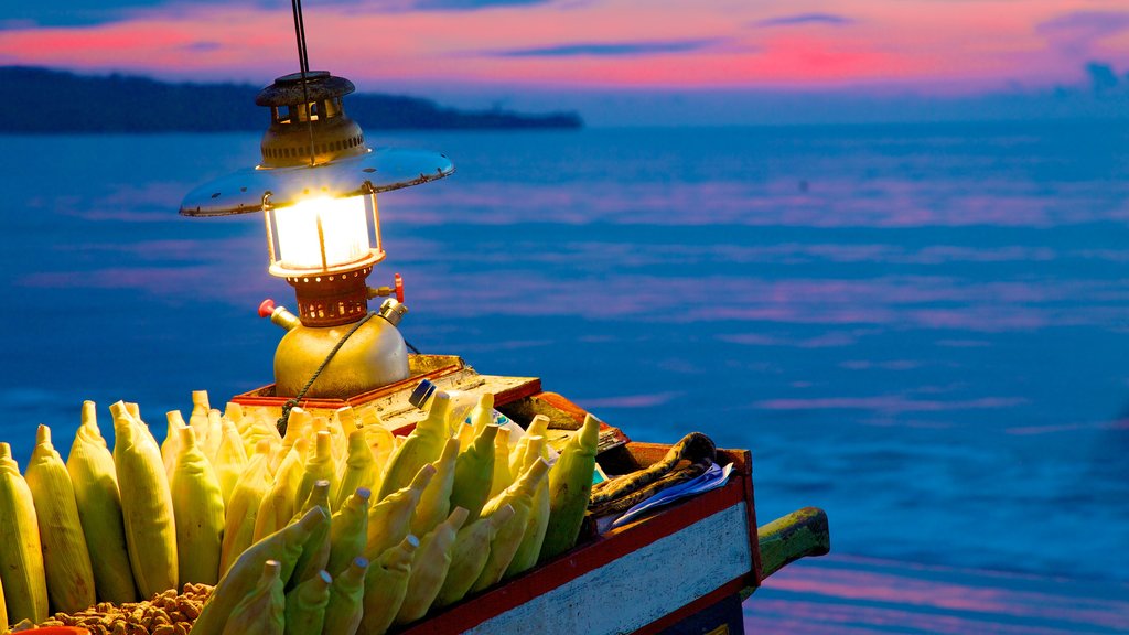 Jimbaran Beach showing a sunset and food