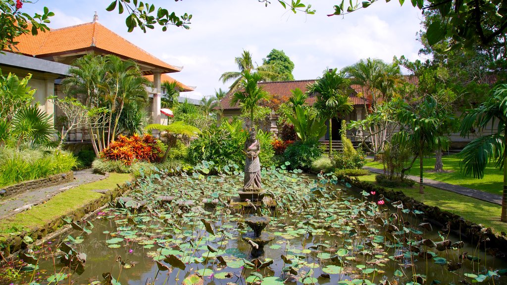 Museum Puri Lukisan featuring tropical scenes, a pond and a garden