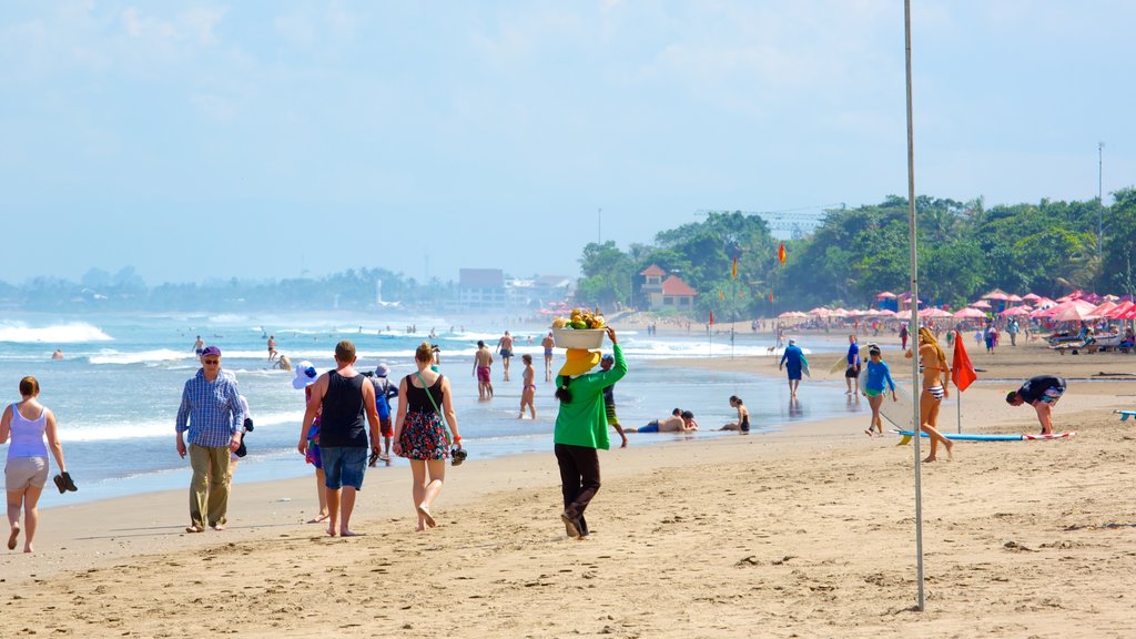 Double Six Beach which includes a sandy beach as well as a large group of people