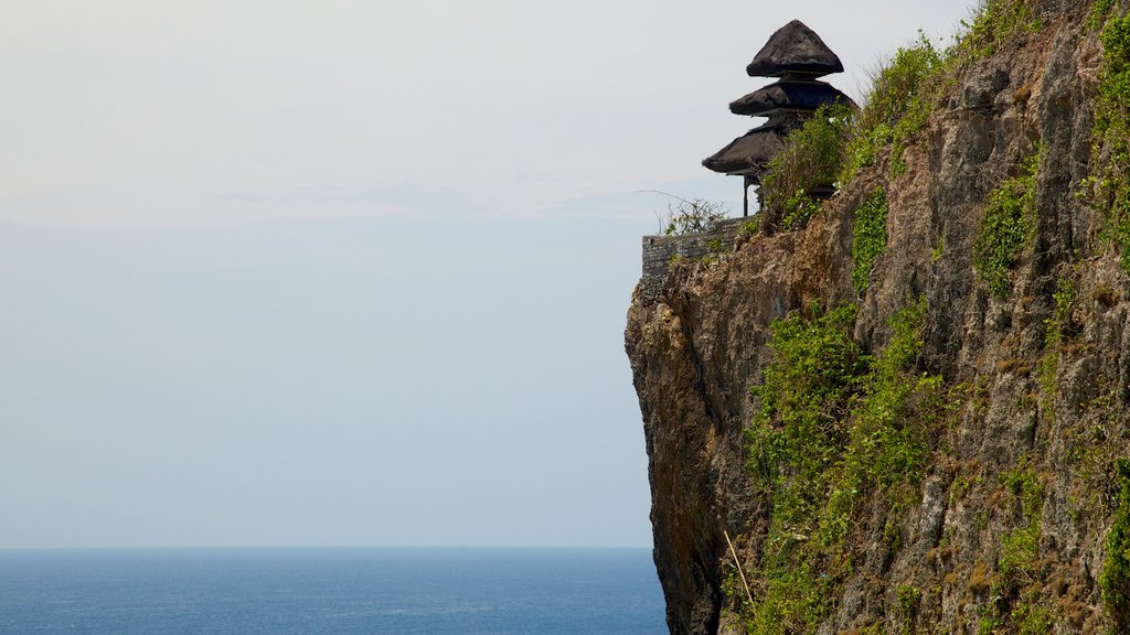 Uluwatu Temple showing rocky coastline and a temple or place of worship