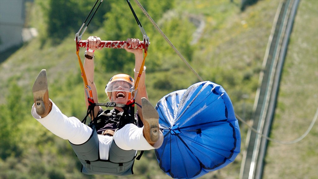 Canada Olympic Park featuring zip lining as well as an individual femail