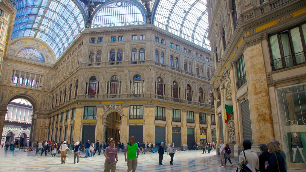 Galleria Umberto featuring shopping and interior views as well as a large group of people