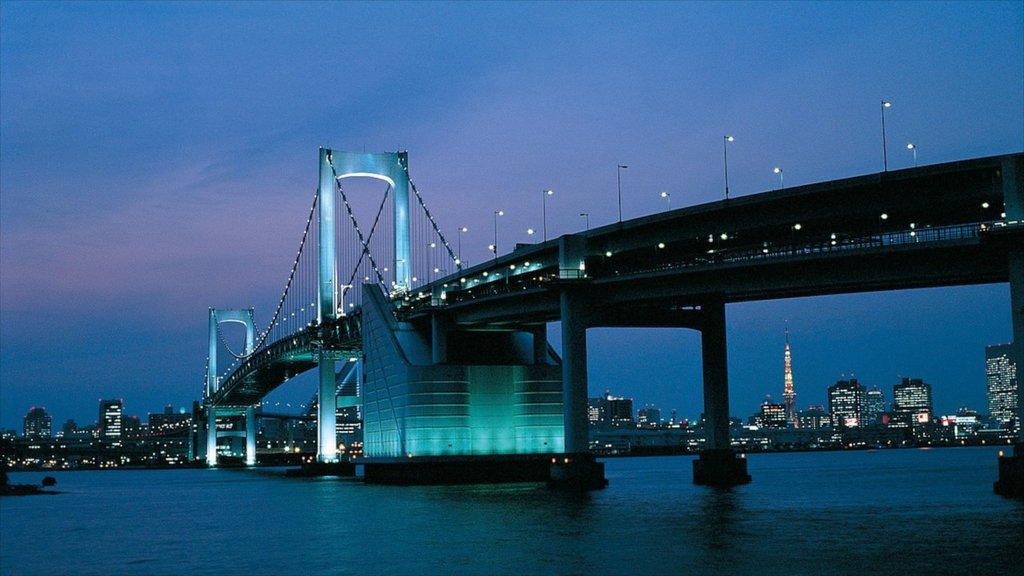 Rainbow Bridge featuring night scenes, a city and general coastal views