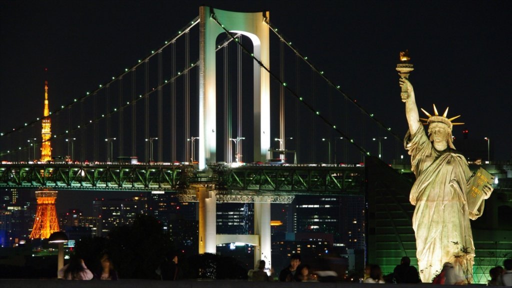 Rainbow Bridge which includes a bridge, a statue or sculpture and night scenes