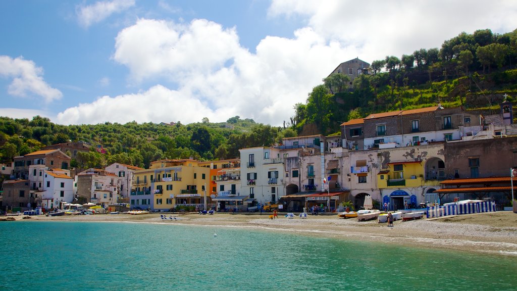 Marina di Puolo showing a coastal town and a sandy beach