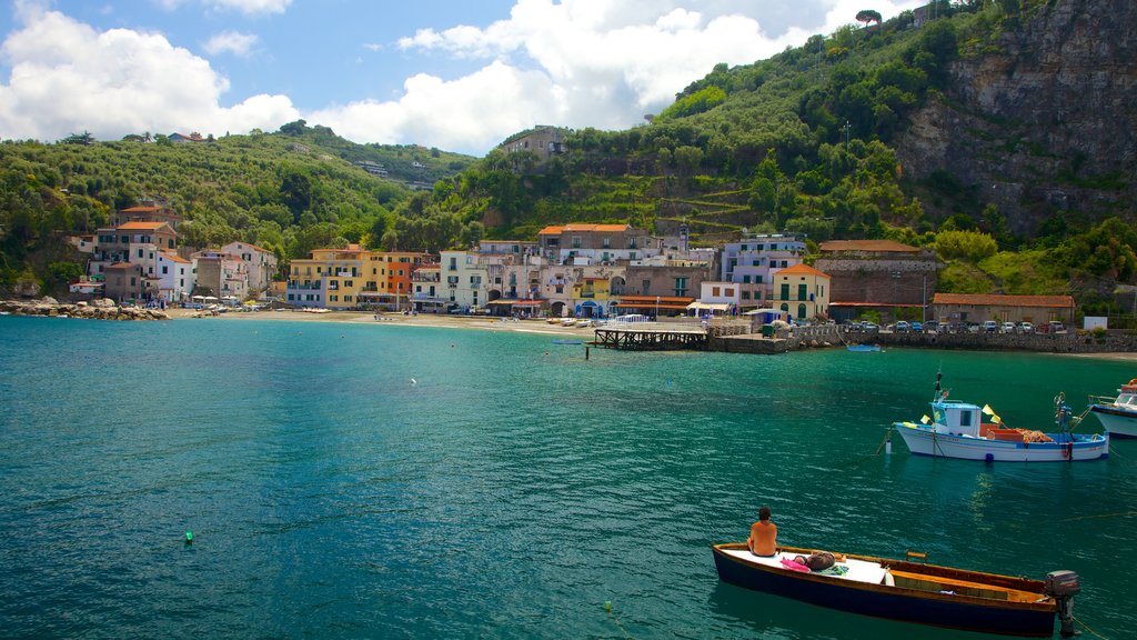 Marina di Puolo which includes landscape views, boating and a coastal town