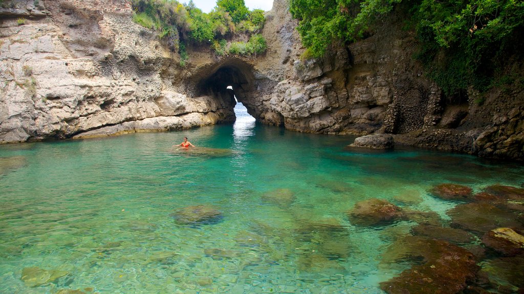 Baths Of Queen Giovanna showing rocky coastline and swimming