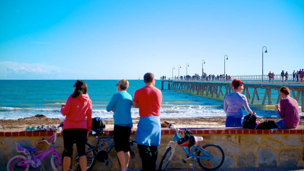 Adelaide showing general coastal views and cycling as well as a large group of people