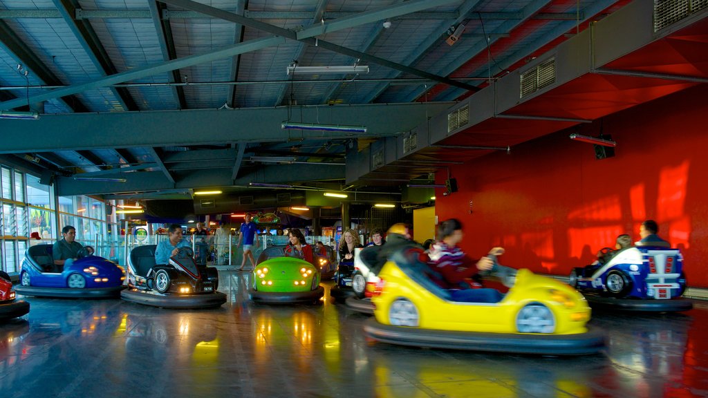 The Beachhouse showing rides and interior views as well as a large group of people