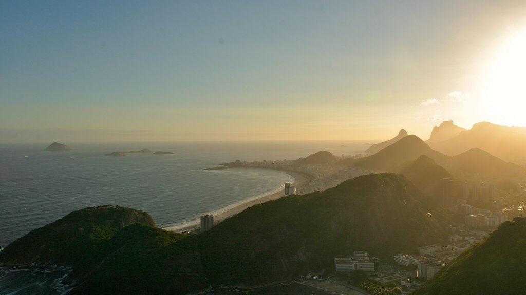 Sugar Loaf Mountain which includes general coastal views, a sunset and mountains