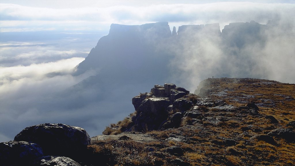 Drakensberg Mountains which includes mountains and mist or fog