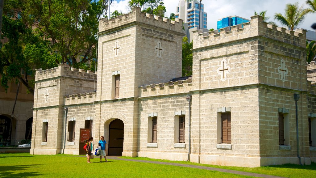 Iolani Palace featuring heritage architecture, a city and château or palace