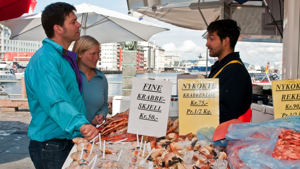 Torget Fishmarket which includes food, signage and markets