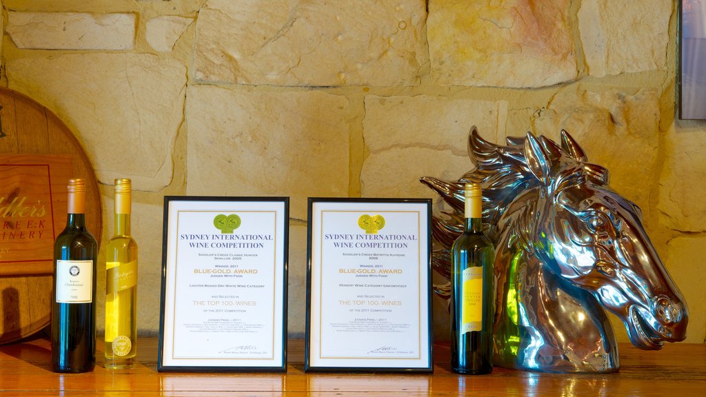 Saddlers Creek Wines featuring signage and drinks or beverages