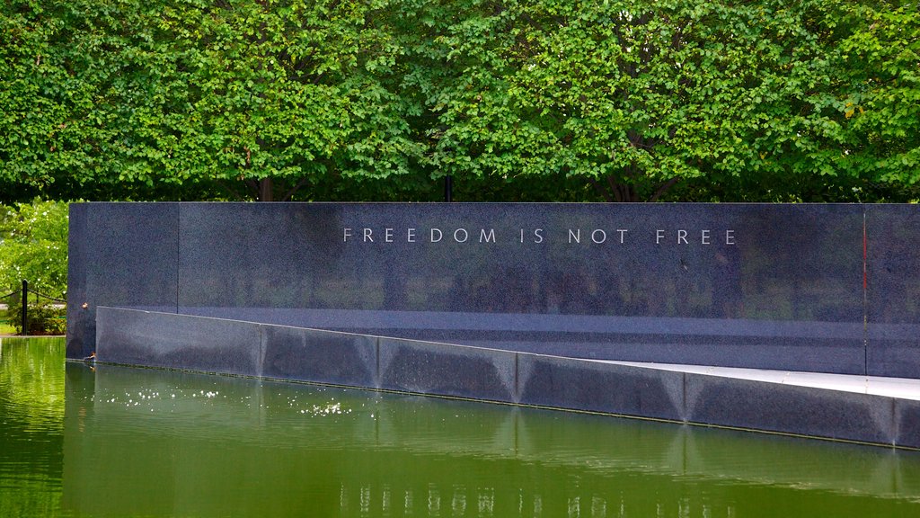 Korean War Veterans Memorial which includes signage, a memorial and a pond